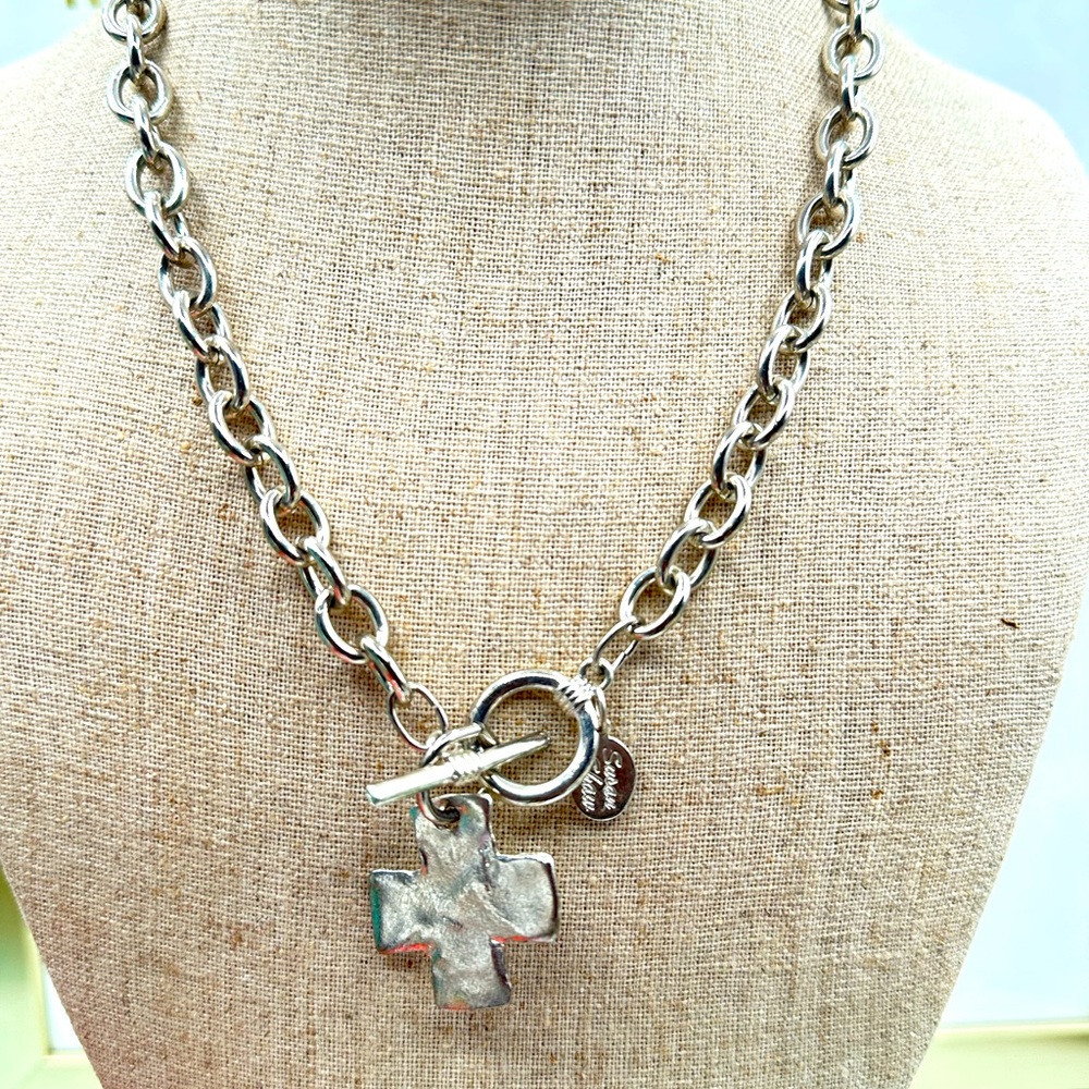 Susan Shaw
Hand cast silver cross with toggle front closure.